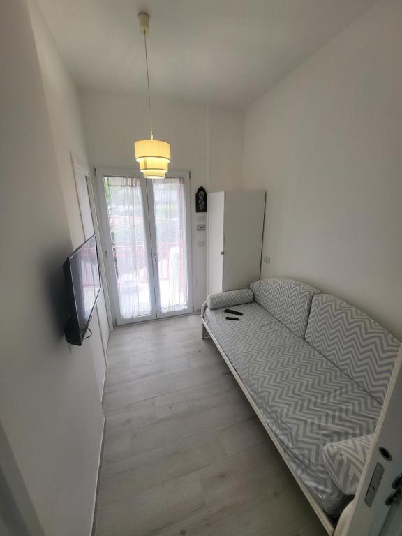Łóżko lub łóżka w pokoju w obiekcie Casa sul Mare Formia Con una Splendida Terrazza