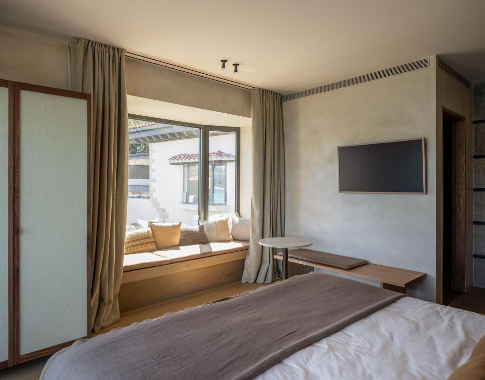 Postel nebo postele na pokoji v ubytování Hotel Ur Bare