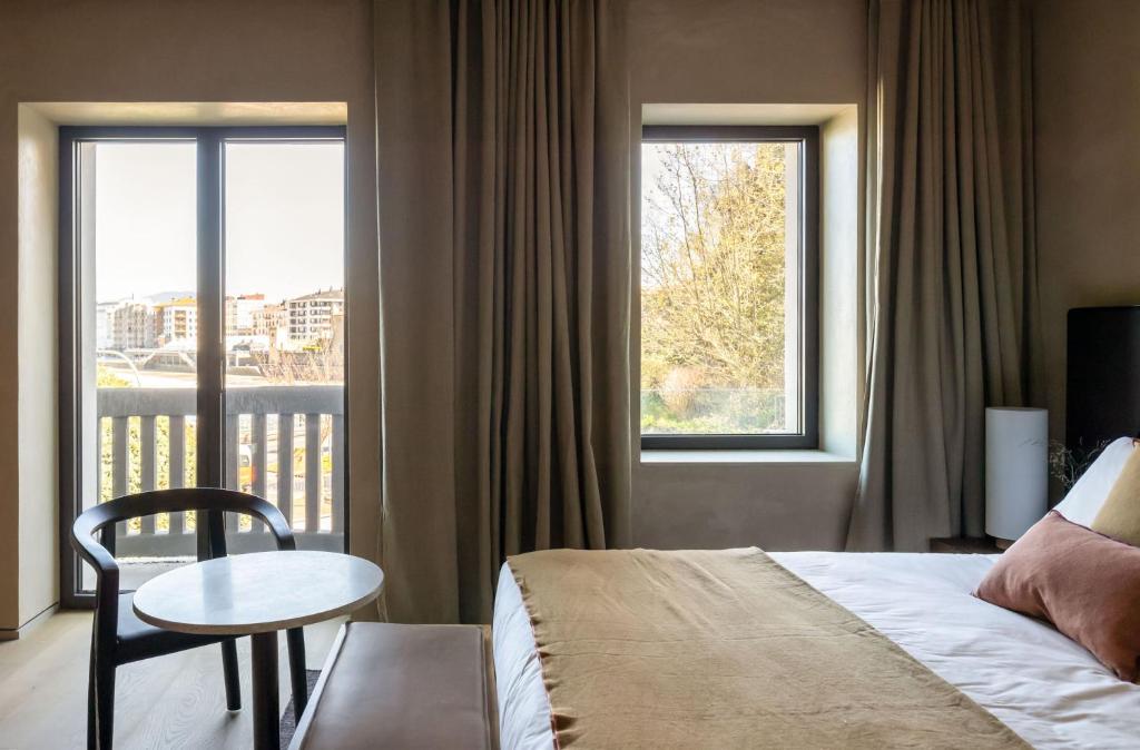 Postel nebo postele na pokoji v ubytování Hotel Ur Bare