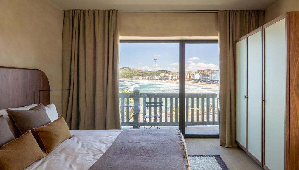 Postel nebo postele na pokoji v ubytování Hotel Ur Bare
