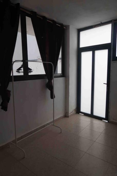 an empty room with a window and a curtain at Jericho Palestine, Panorama Villa- View, Full Privacy & Pool in Jericho