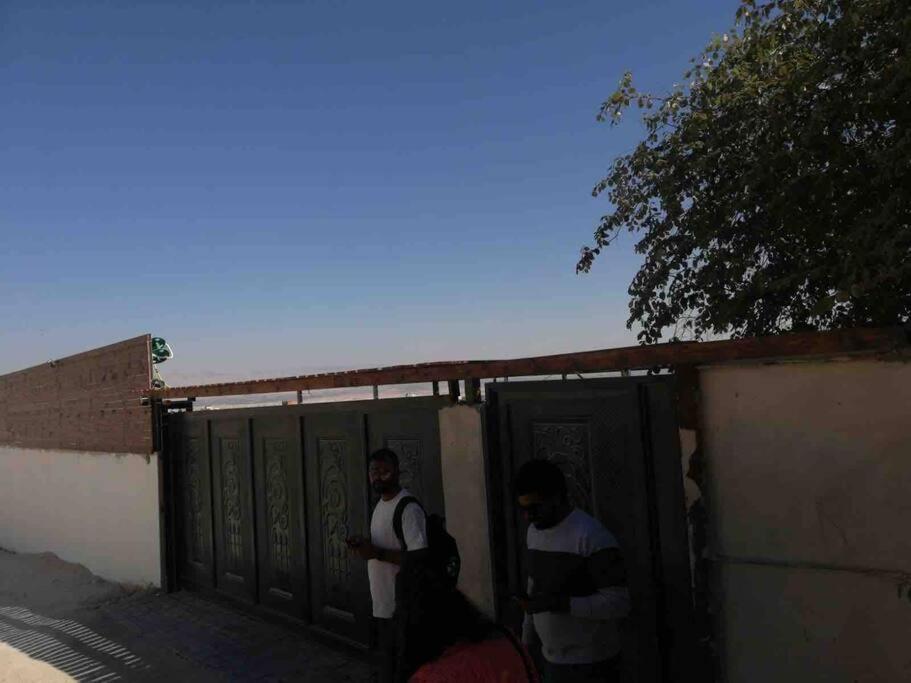 two men standing in a gate of a building at Jericho Palestine, Panorama Villa- View, Full Privacy & Pool in Jericho
