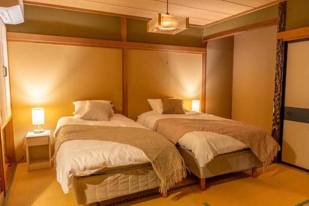 Postel nebo postele na pokoji v ubytování Elan Hotel Lake Nojiri
