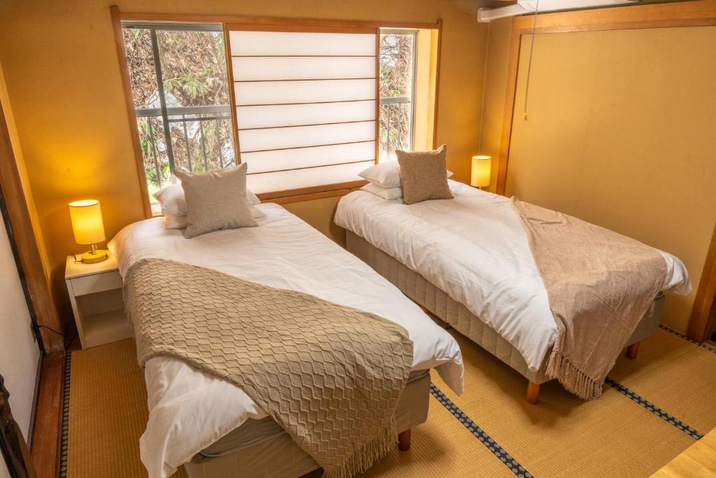 Postel nebo postele na pokoji v ubytování Elan Hotel Lake Nojiri