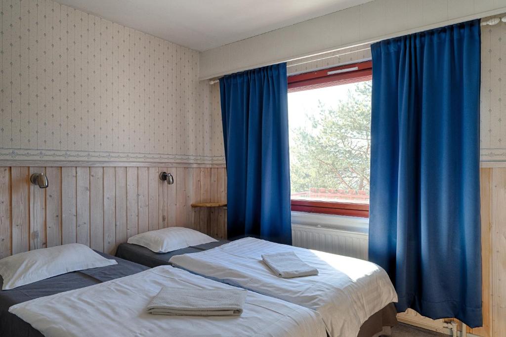 Postel nebo postele na pokoji v ubytování Guesthouse Borealis