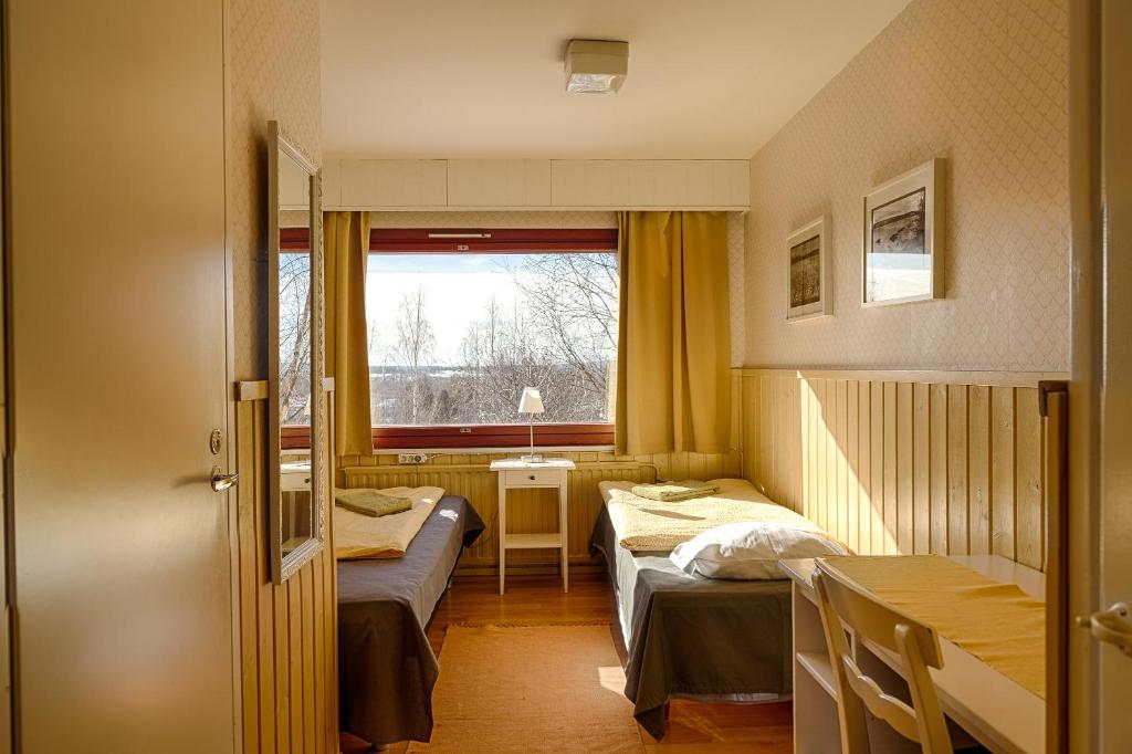 Postel nebo postele na pokoji v ubytování Guesthouse Borealis