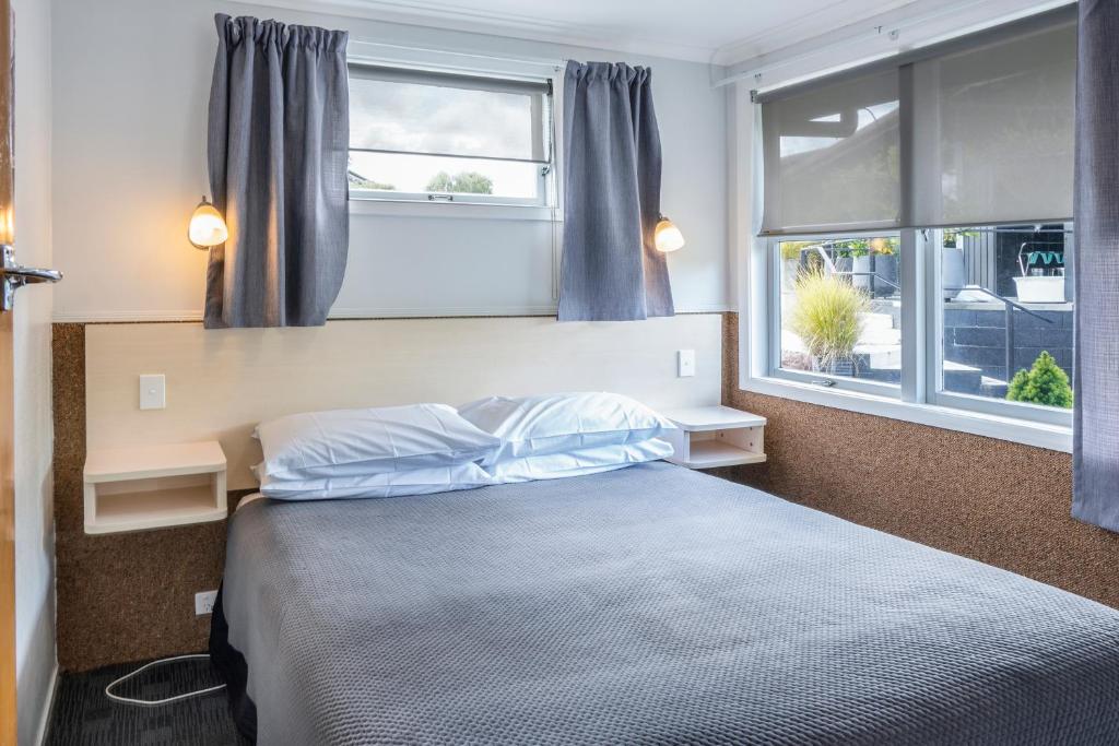 Postel nebo postele na pokoji v ubytování Dunrovin Motel