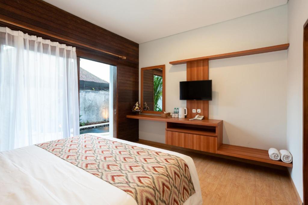 Postel nebo postele na pokoji v ubytování Paisa Ubud
