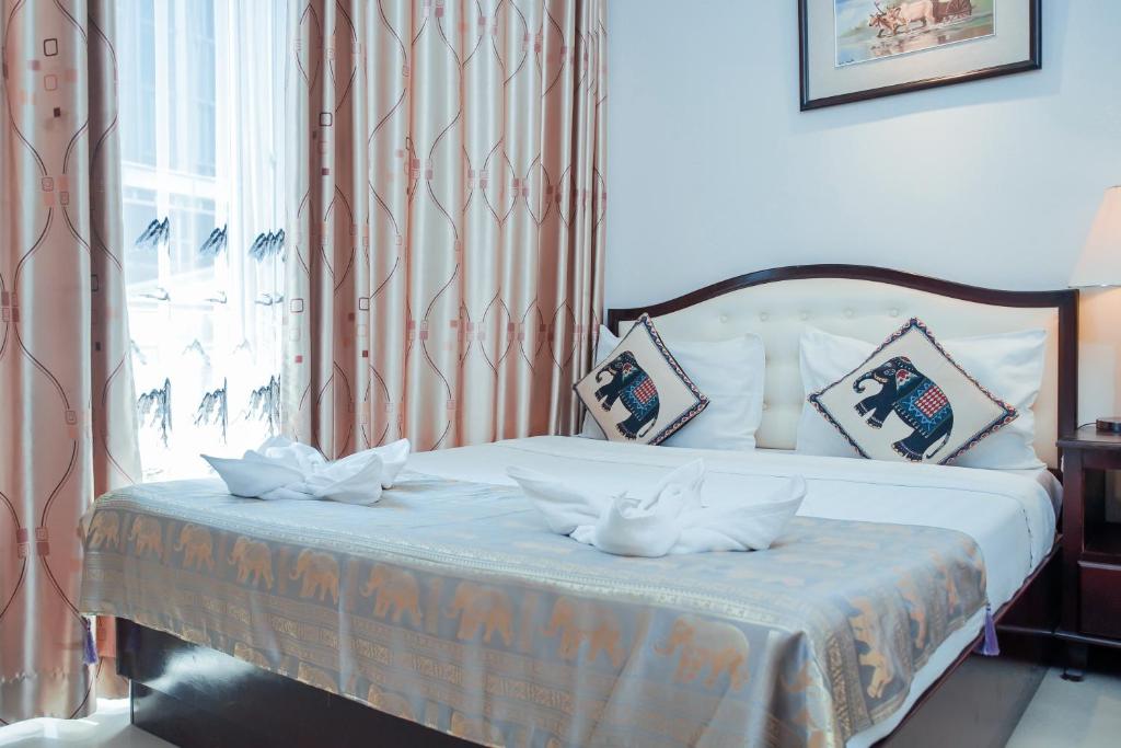 Postel nebo postele na pokoji v ubytování Silver Mounts Hotel