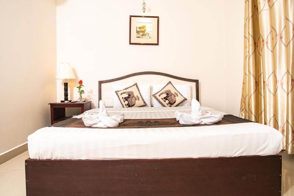 Postel nebo postele na pokoji v ubytování Silver Mounts Hotel