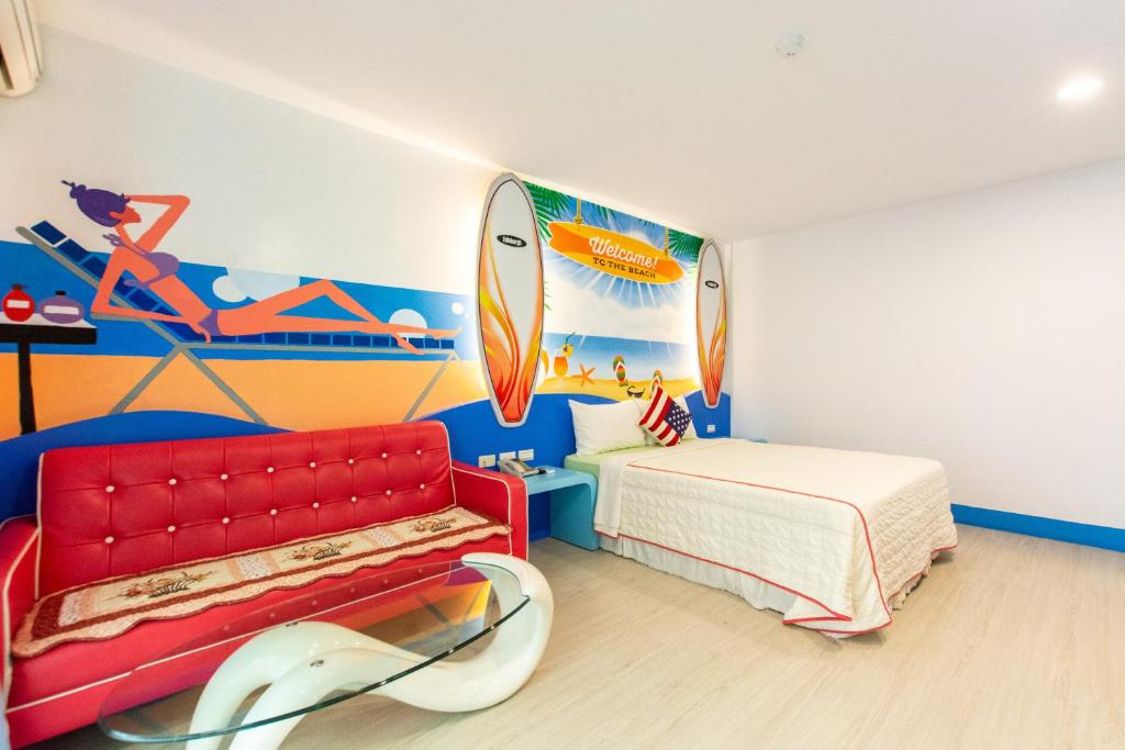 a bedroom with a bed and a surfboard mural at Ocean Star B&amp;B in Kenting