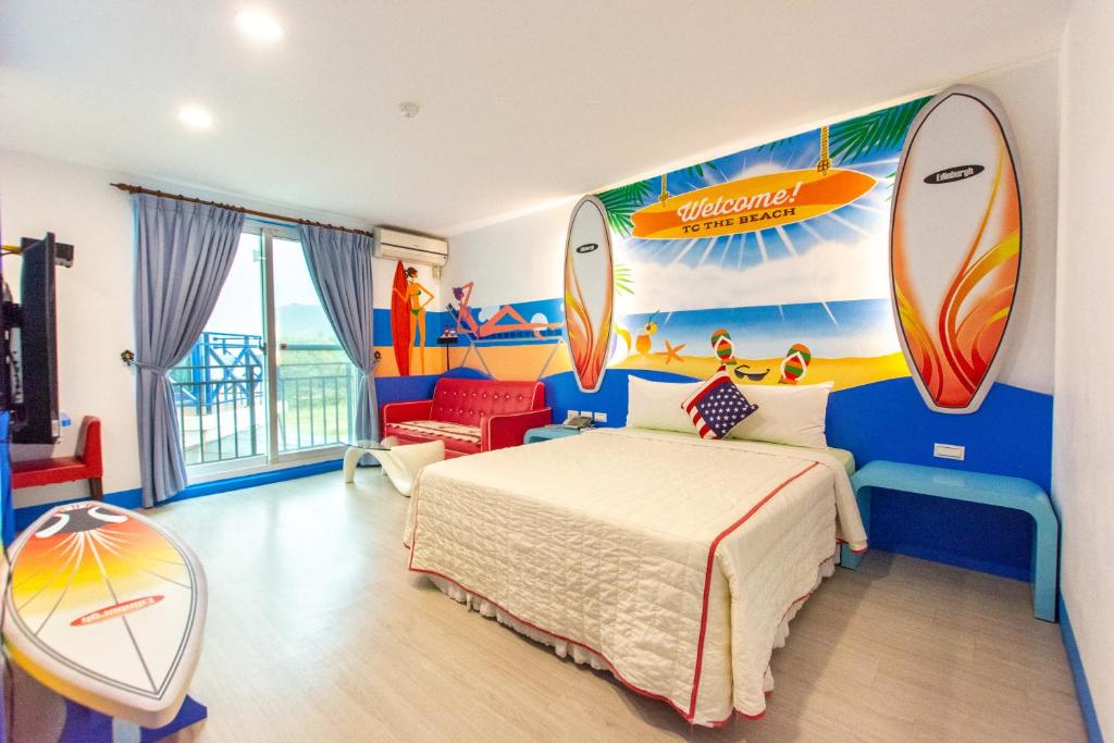 a bedroom with a bed with surfboards on the wall at Ocean Star B&amp;B in Kenting