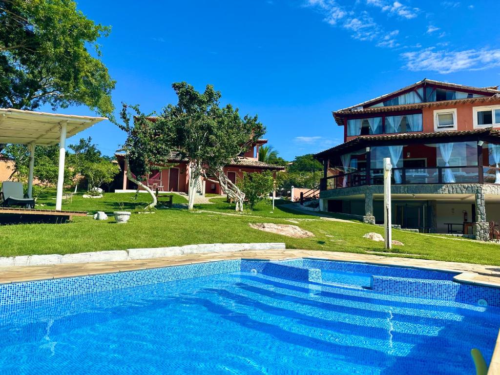 Der Swimmingpool an oder in der Nähe von Pousada Le Jardin de Búzios