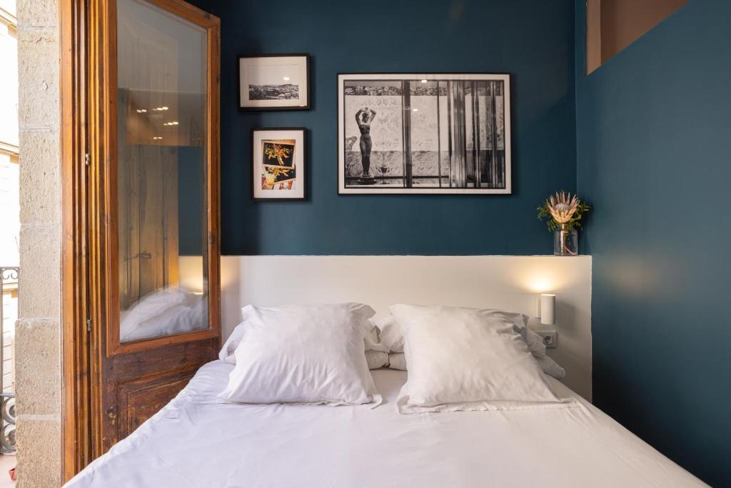 Postel nebo postele na pokoji v ubytování Hostal Sol y K