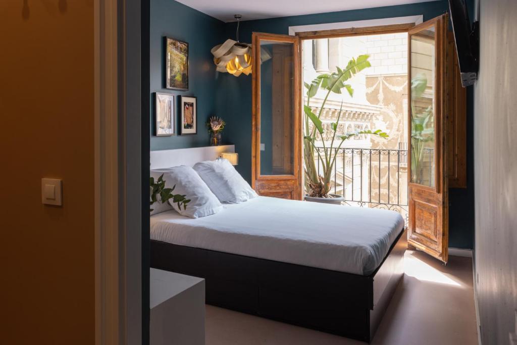 Postel nebo postele na pokoji v ubytování Hostal Sol y K