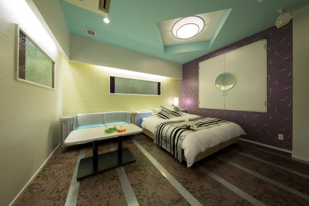 Postel nebo postele na pokoji v ubytování HOTEL AUBE