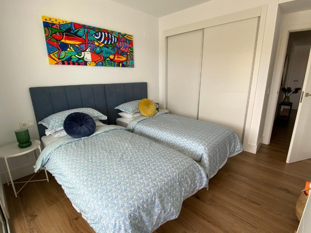 Postel nebo postele na pokoji v ubytování La Marina Sotogrande Pier2