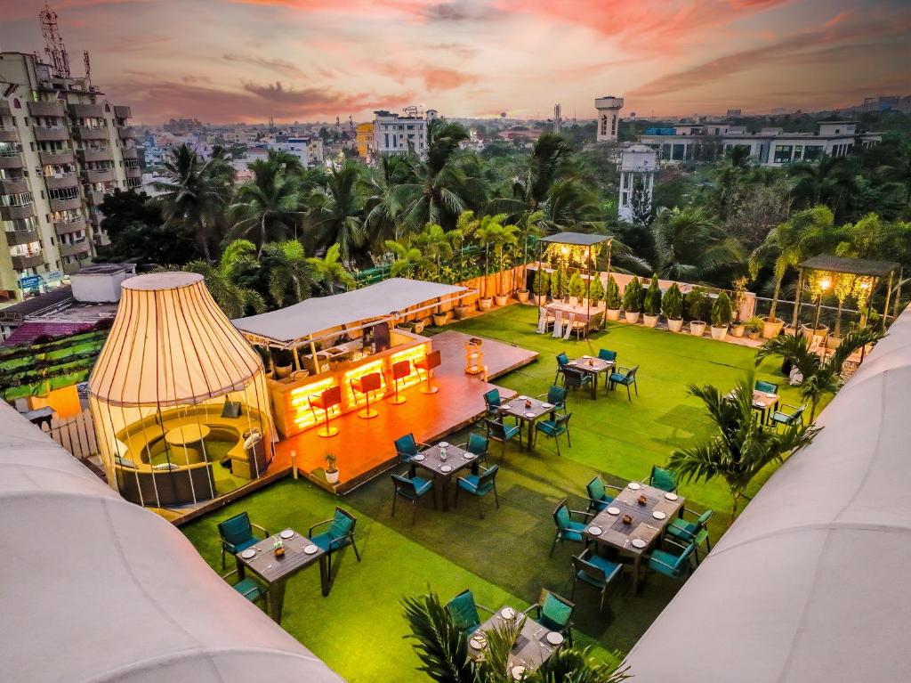 an overhead view of a building with tables and chairs at Hotel Pal Heights in Bhubaneshwar