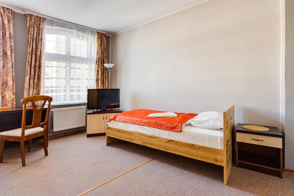 Posteľ alebo postele v izbe v ubytovaní Hotel Sowa