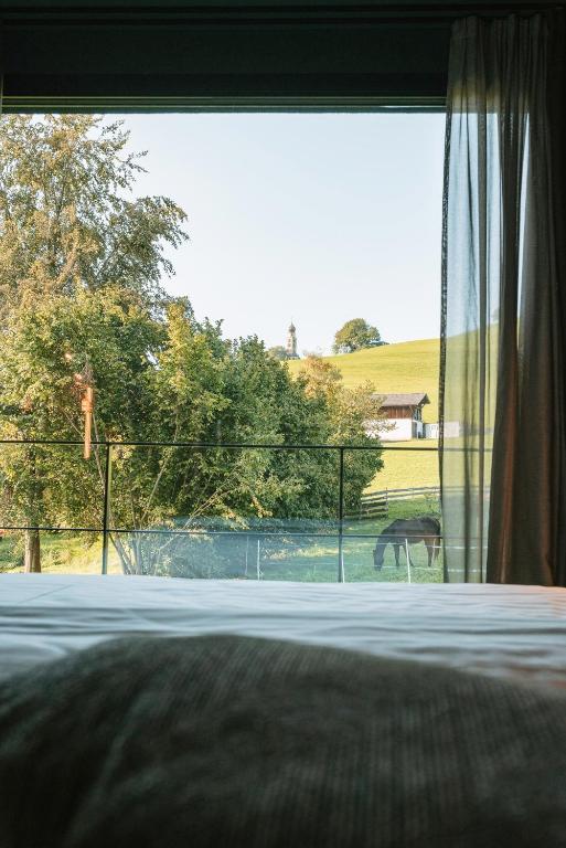 A bed or beds in a room at Floris Green Suites by Parc Hotel Florian