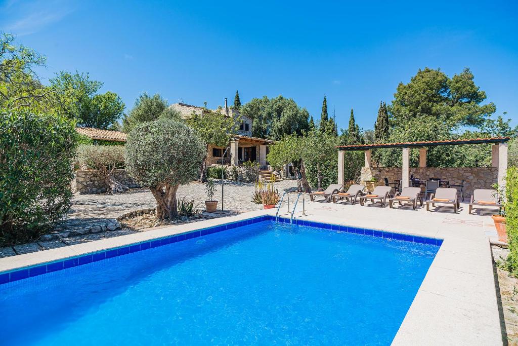 a swimming pool in the backyard of a house at Noguera -Pollensa in Pollença