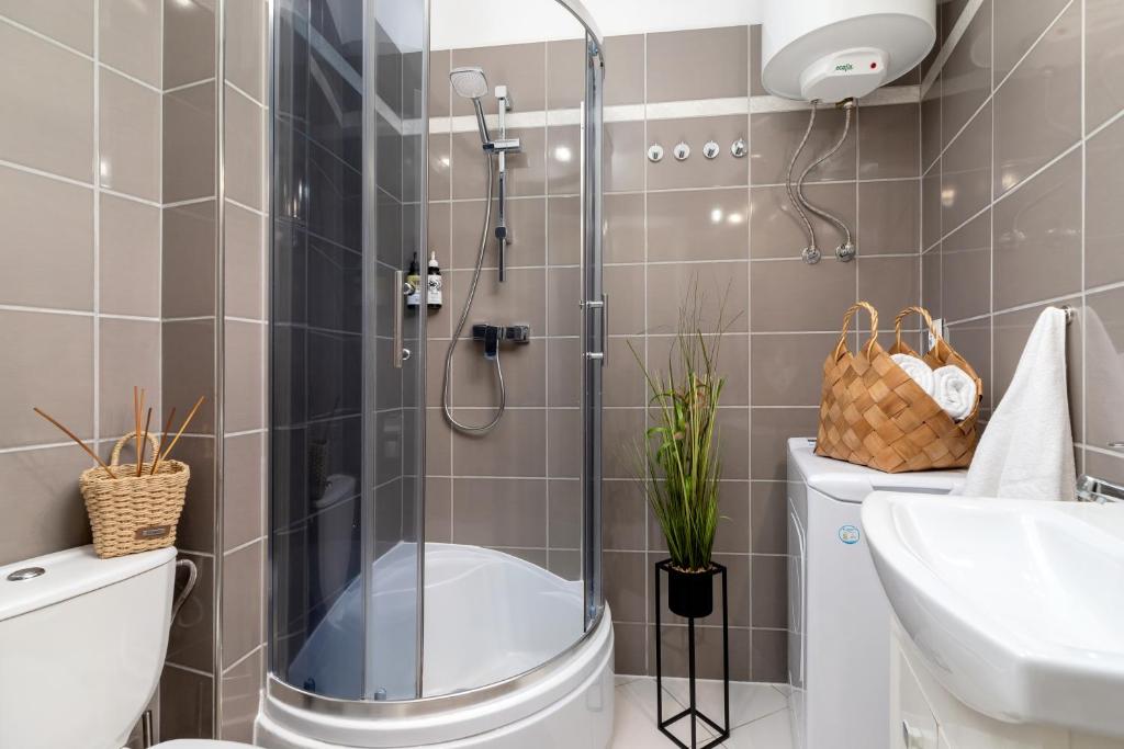 Kúpeľňa v ubytovaní WOW Apartment by Cozyplace