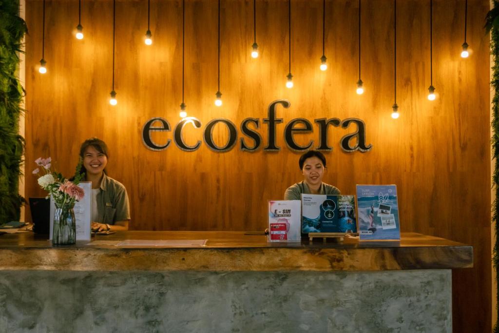 two women sitting at a counter in a restaurant at Ecosfera Hotel & Spa in Canggu