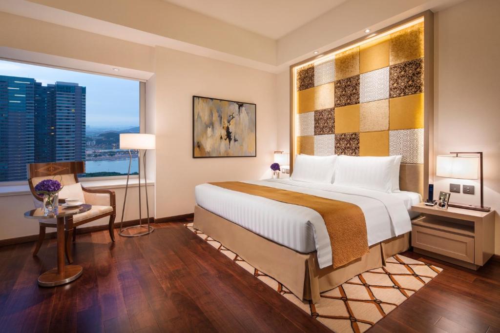 Postel nebo postele na pokoji v ubytování Ascott Macau