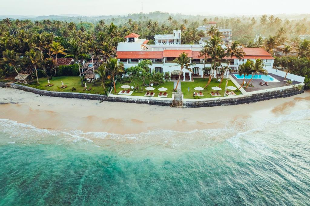 an aerial view of a resort on the beach at Mosvold Villa in Ahangama