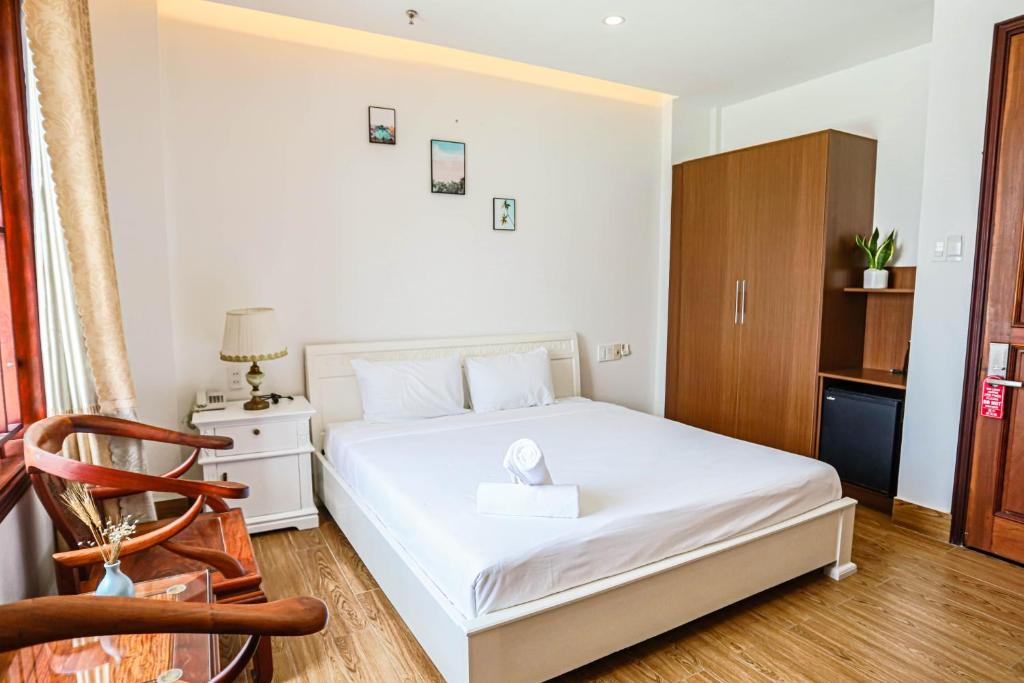 Giường trong phòng chung tại SeaColor Beachstay Danang Hotel by Haviland