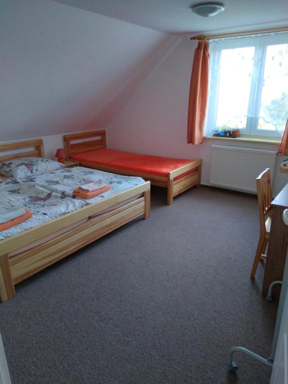Postel nebo postele na pokoji v ubytování Penzion HORTENZIE