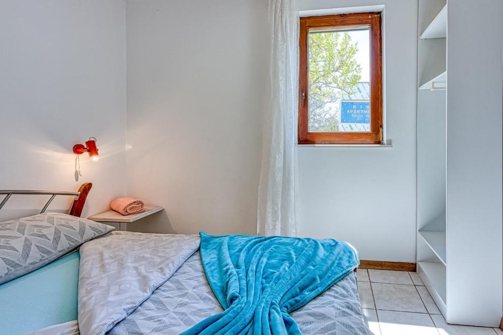 Łóżko lub łóżka w pokoju w obiekcie Apartments Kiki Spada