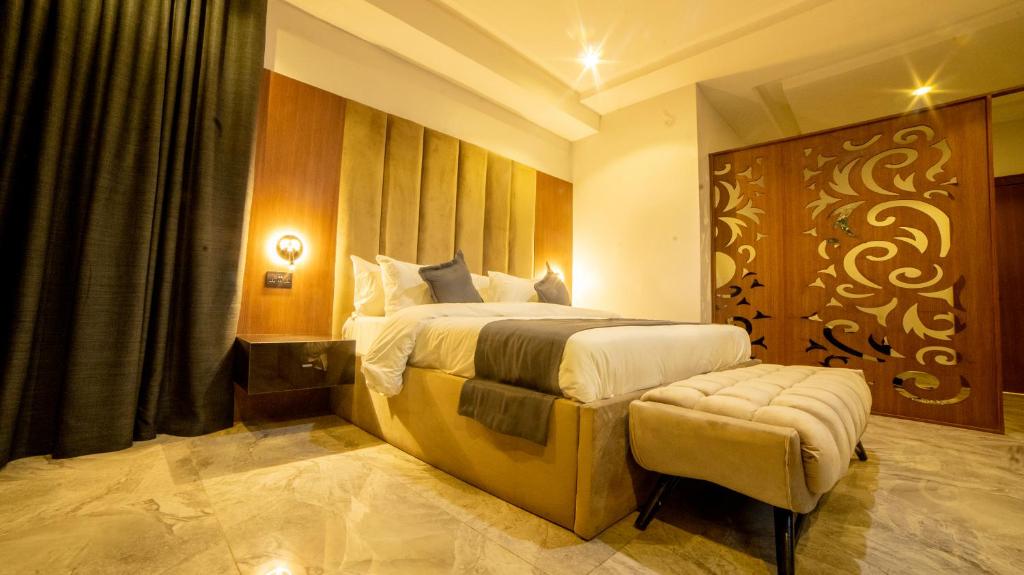 Postel nebo postele na pokoji v ubytování Tranquila Hotels and Suites Abuja