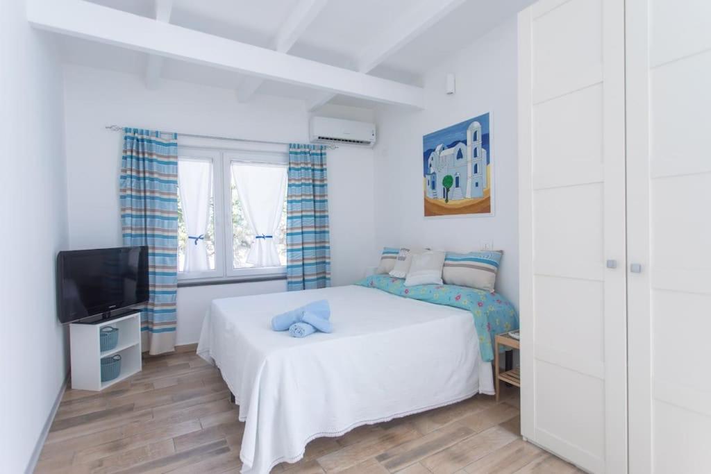 Ένα ή περισσότερα κρεβάτια σε δωμάτιο στο Miniappartamento centro storico Forio d'Ischia