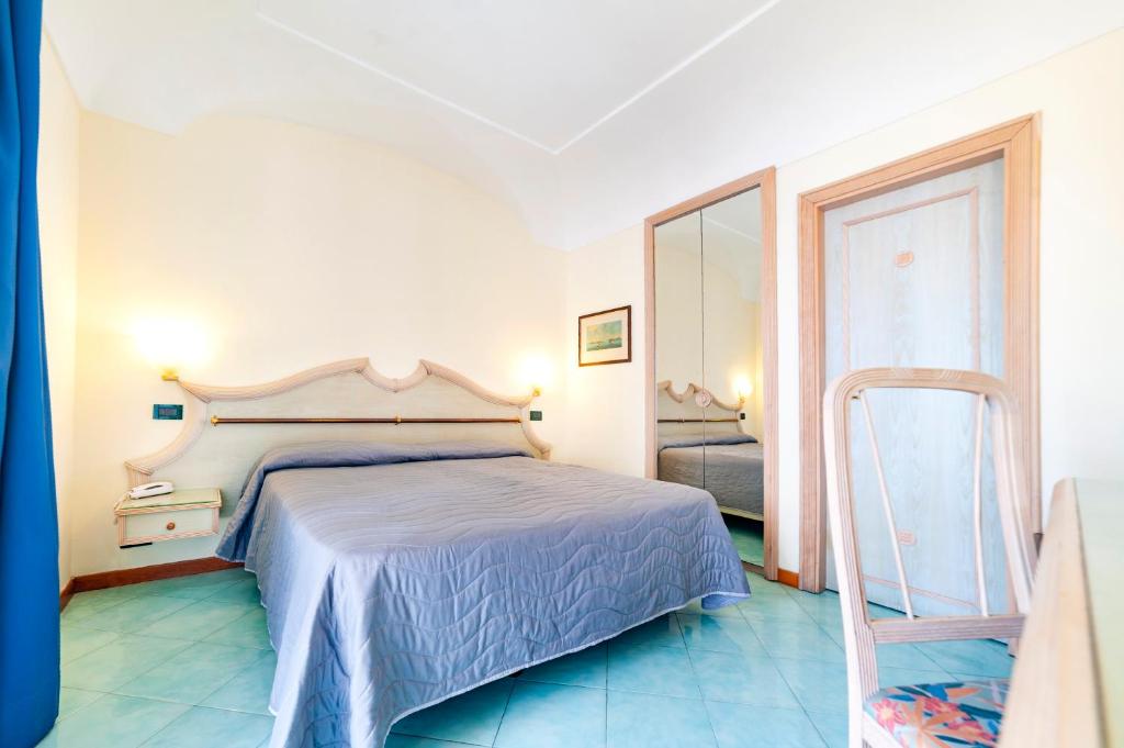 Postel nebo postele na pokoji v ubytování Hotel Terme Don Pepe