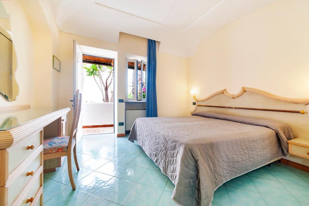 Postel nebo postele na pokoji v ubytování Hotel Terme Don Pepe