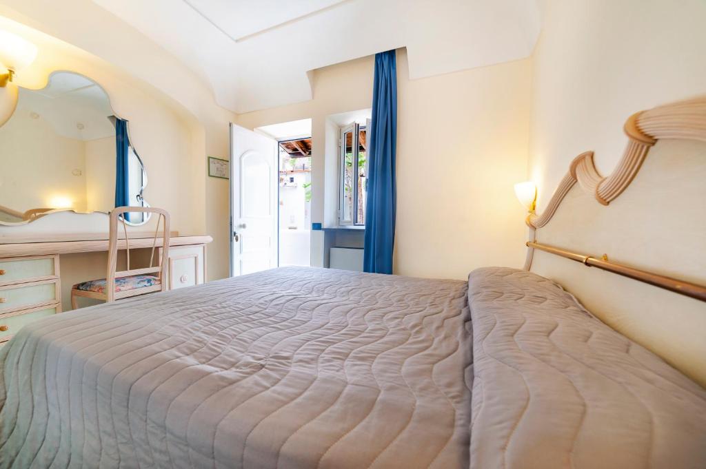 Postel nebo postele na pokoji v ubytování Hotel Terme Don Pepe