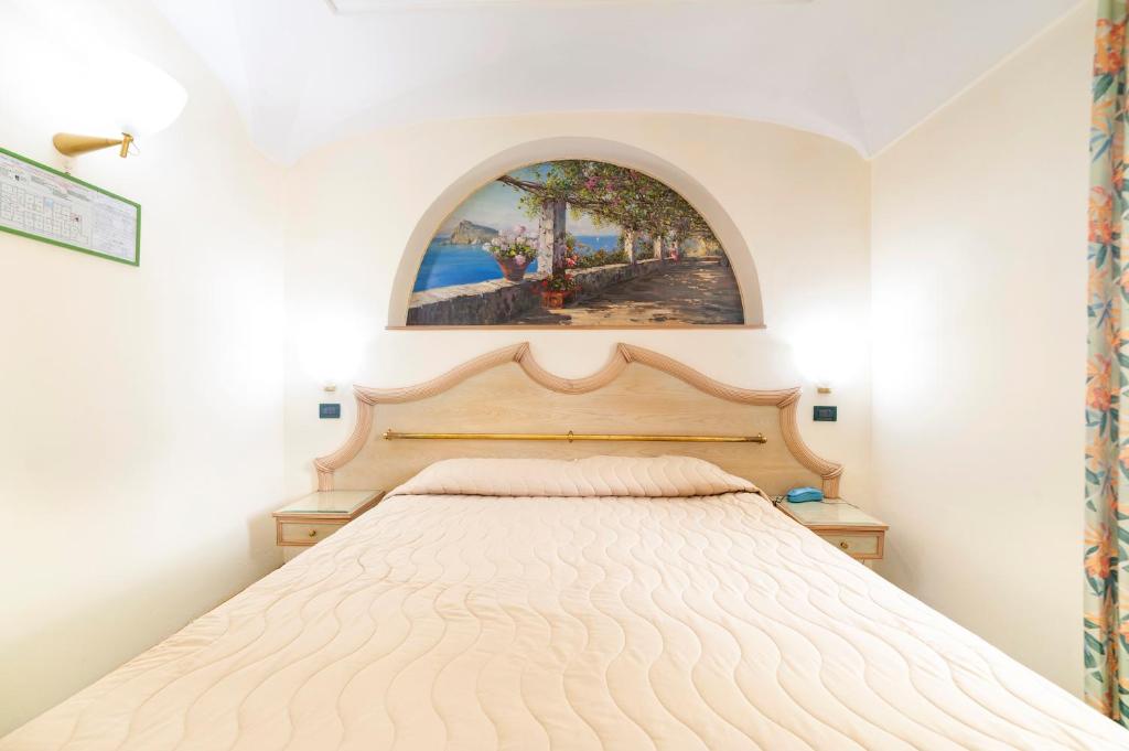 Postel nebo postele na pokoji v ubytování Hotel Terme Don Pepe