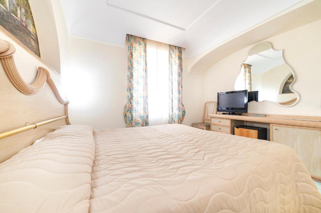 Postel nebo postele na pokoji v ubytování Hotel Terme Don Pepe