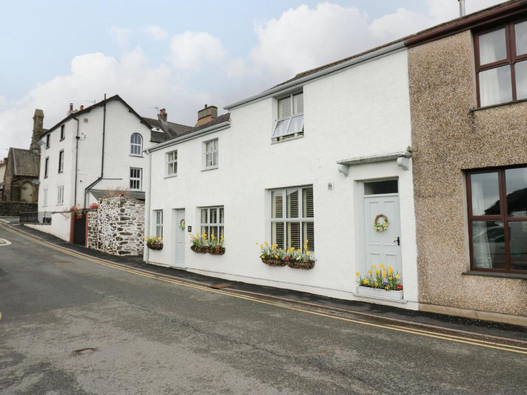 a row of white houses on a street at The Anvil in Broughton in Furness