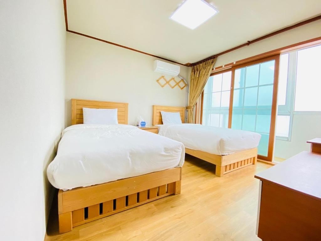 Postel nebo postele na pokoji v ubytování Billions Motel
