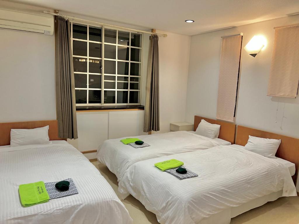 Postel nebo postele na pokoji v ubytování JAS HOTEL TAKAYAMA