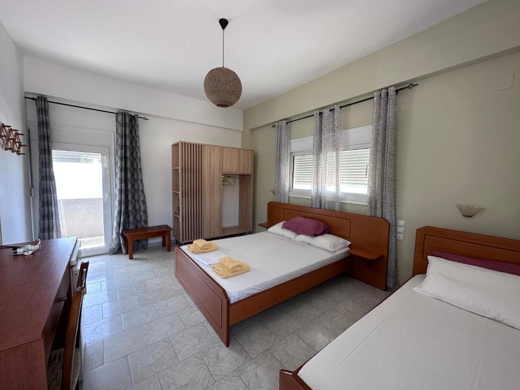 Postel nebo postele na pokoji v ubytování Voula Beach