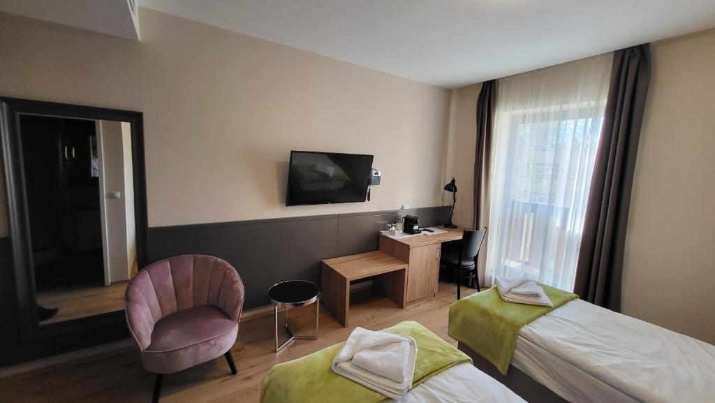 TV a/nebo společenská místnost v ubytování D50 Hotel