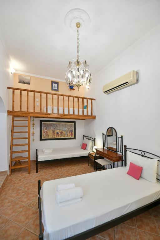 A bed or beds in a room at Maria's House