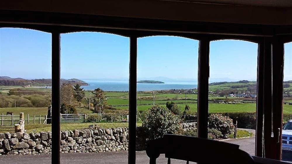 a view of the ocean from a house window at Collin Hill House in Castle Douglas