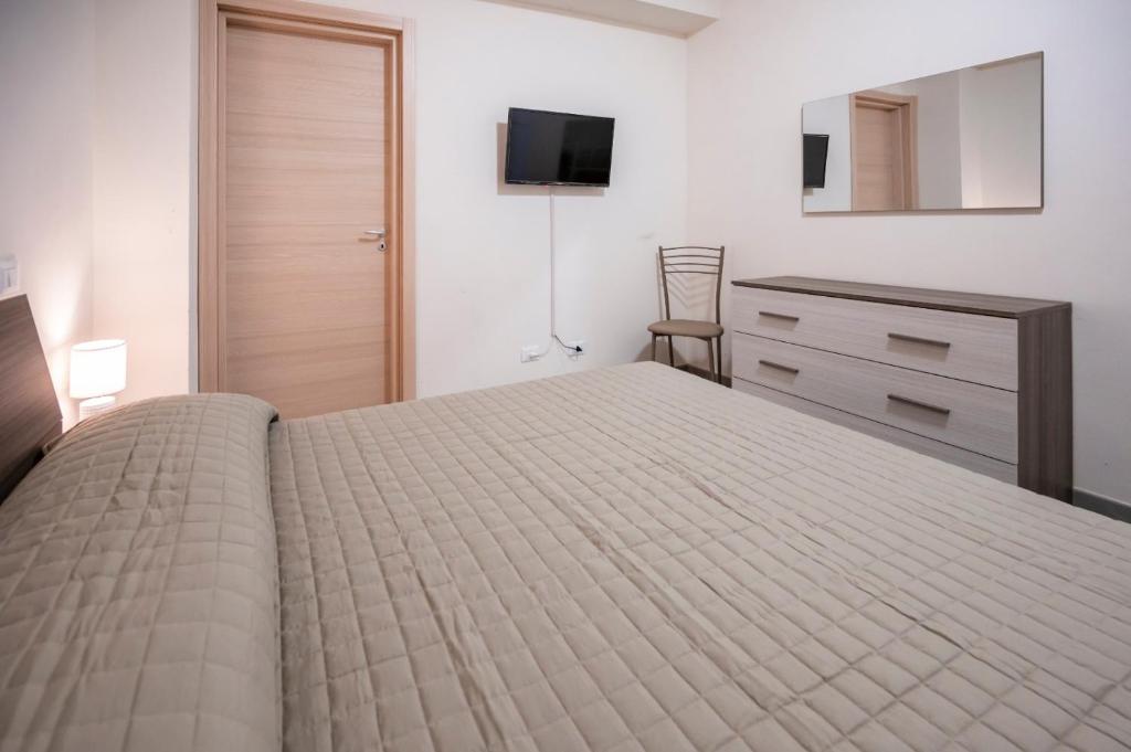 A bed or beds in a room at La Casa del Gelsomino tra Noto e Mare