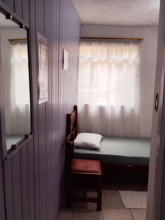 Postel nebo postele na pokoji v ubytování Hospedagem Progresso