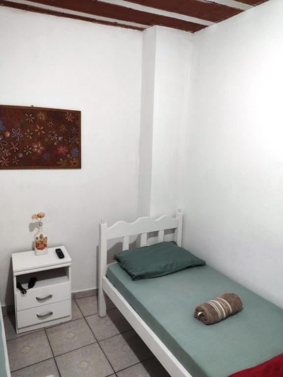 Postel nebo postele na pokoji v ubytování Hospedagem Progresso