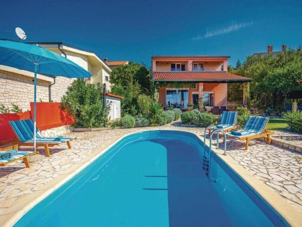 a villa with a swimming pool and a house at Villa Mery in Šmrika